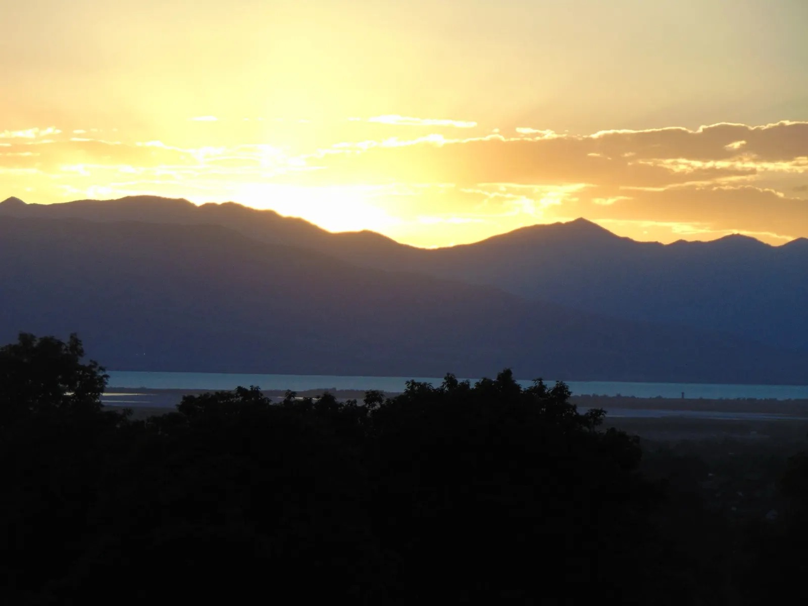 Golden sunset over Utah Lake and the mountains of Utah Valley